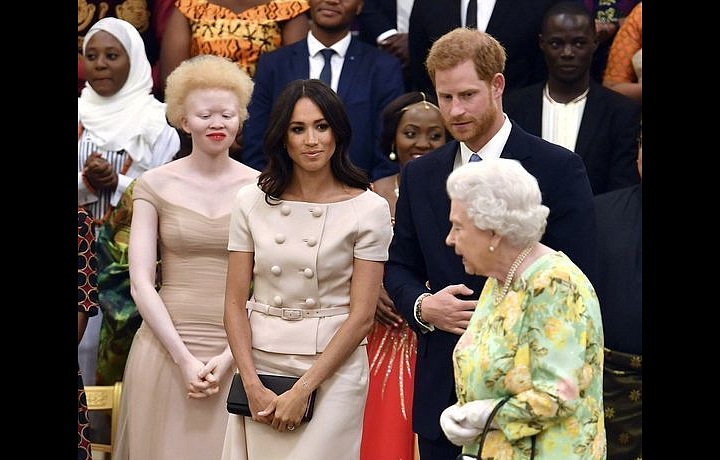 Meghan with Elizabeth II