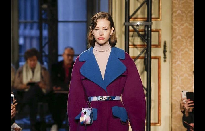 Luxury coats emphasize women's waist.