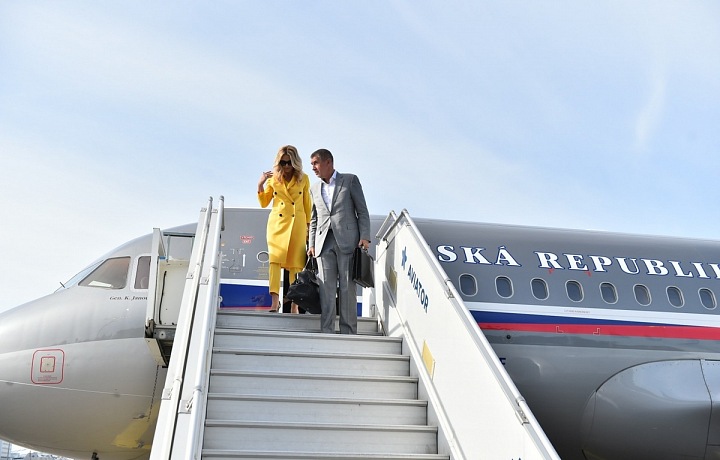 With wife Monika, he has to travel abroad 