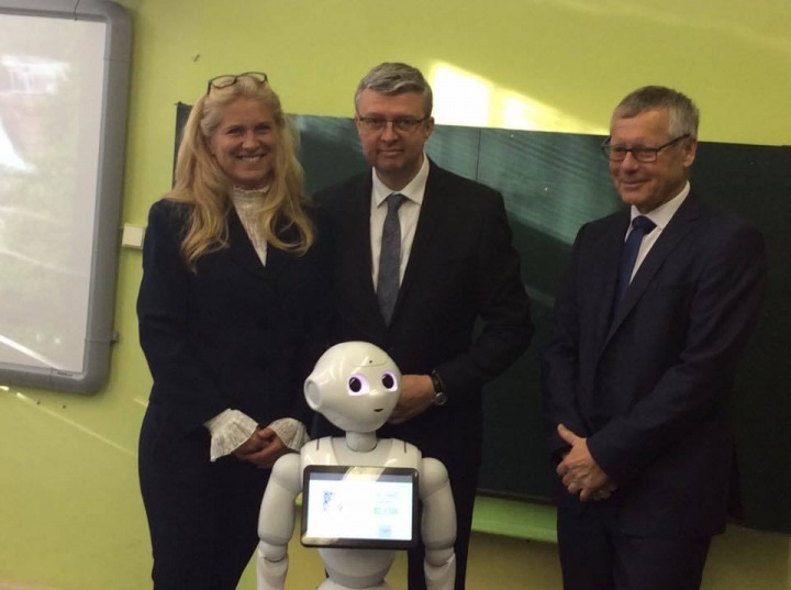  Adults are also fascinated by the robot.