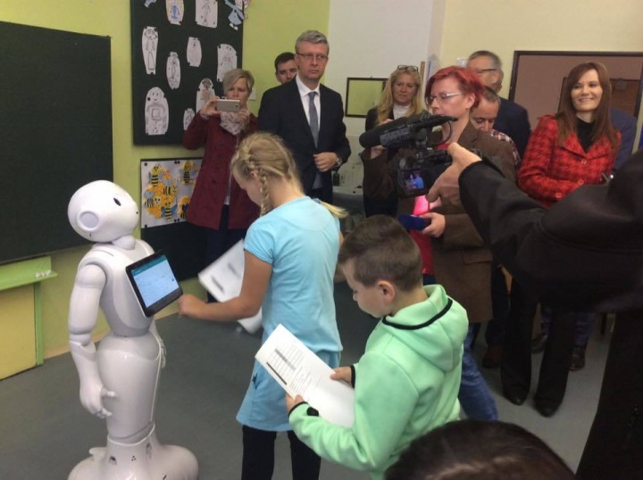 The pupils are excited about the robot.