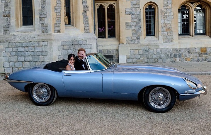 Meghan and Harry in Jaguar E Type Zero