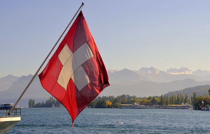 The Swiss flag above Lake Geneva.